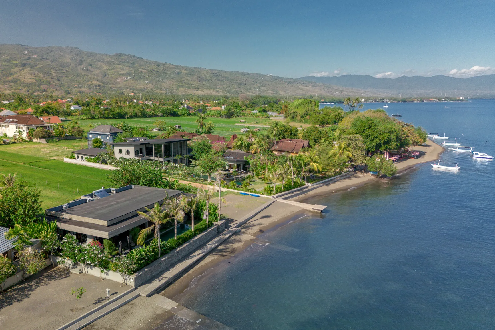 Aerial view of the Sea View beachfront in Lovina: the Beach Estate on the sand and the Pool Villa behind it