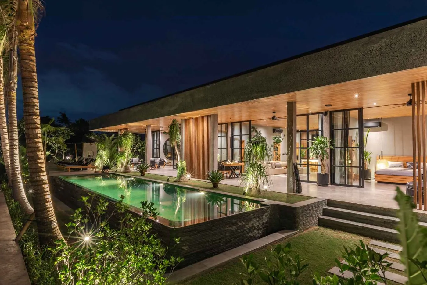 The estate at night, pool lit
