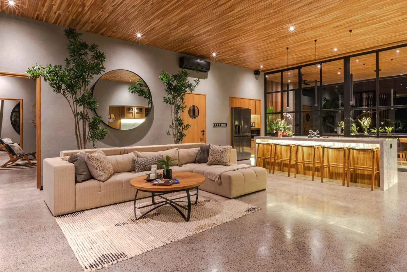 The living room and marble kitchen bar at night