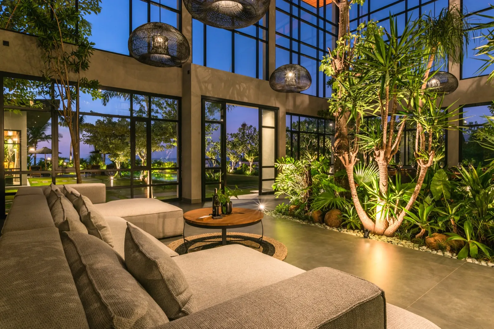 The pool at dusk, loungers along the water